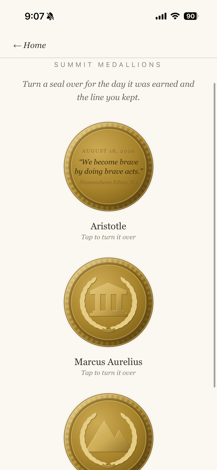 Thinkr app: struck bronze Summit Medallions displayed on the shelf